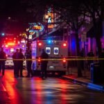 Police and emergency vehicles respond to mass shooting scene on Sixth Street in Austin Texas at night
